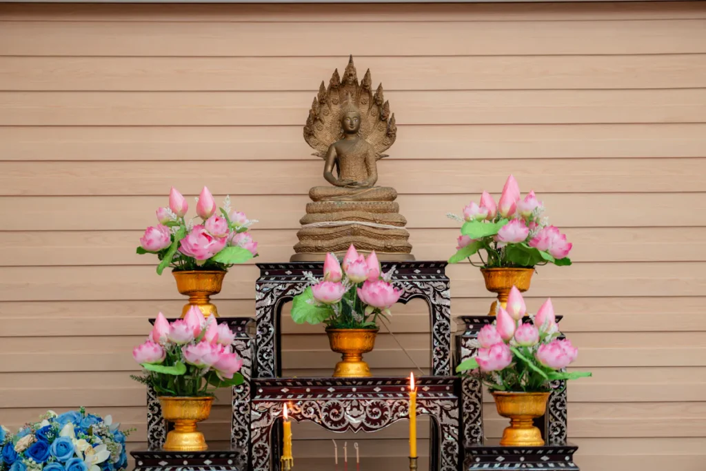 A serene and ornate Buddhist altar adorned with lotus flowers in Lam Sai, Thailand, captures cultural spirituality.